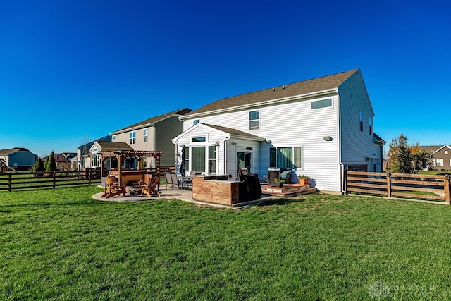 back of property featuring a yard, a patio, and exterior kitchen