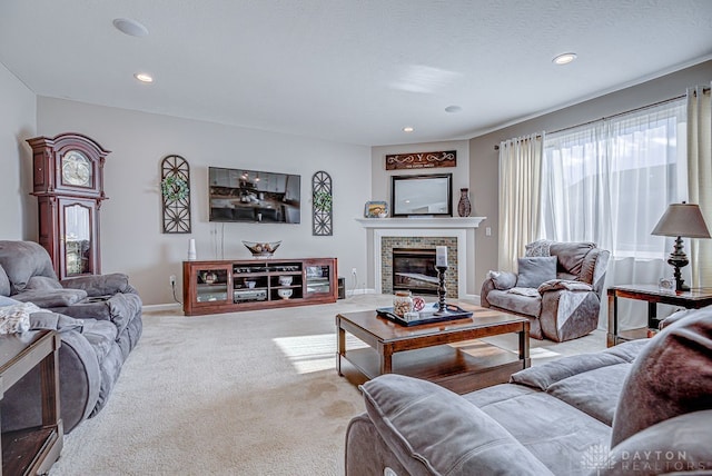 carpeted living room with a brick fireplace