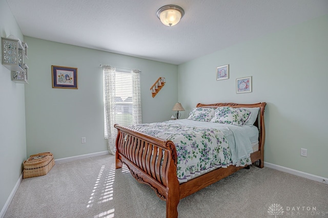 bedroom featuring light colored carpet