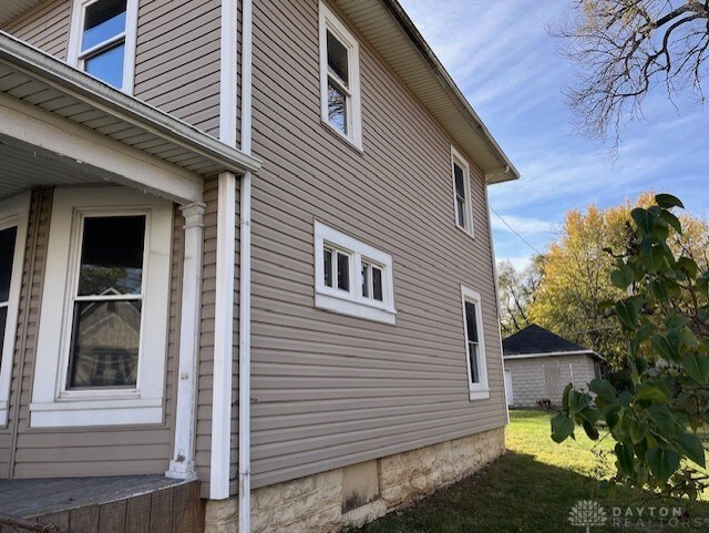 view of home's exterior with a lawn