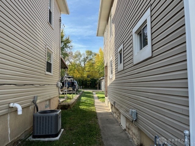 view of side of property featuring central AC unit