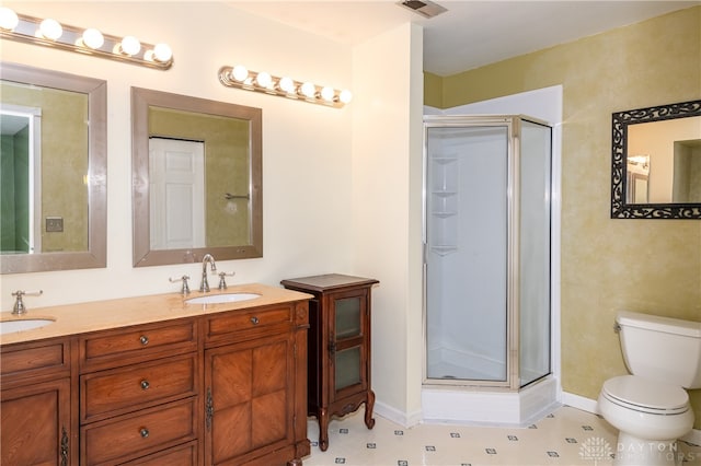 bathroom featuring toilet, walk in shower, and vanity