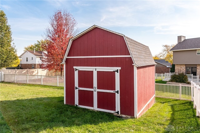 view of outdoor structure with a lawn