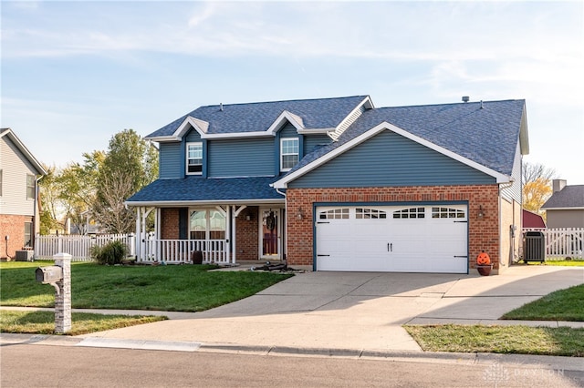 view of front of house with central air condition unit, covered porch, a front yard, and a garage