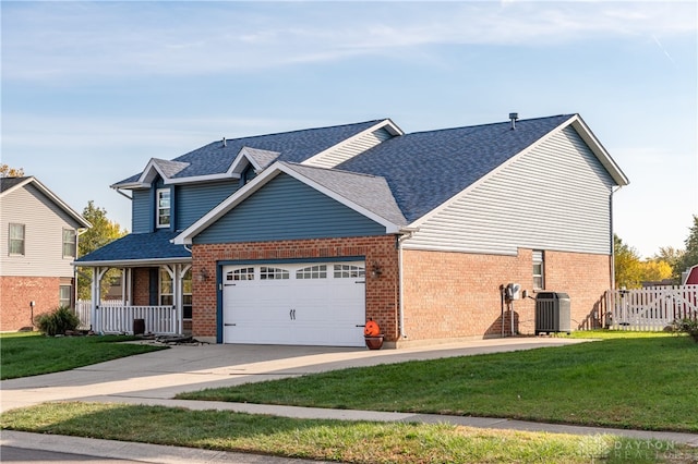 view of front of home with covered porch, a front yard, and central air condition unit