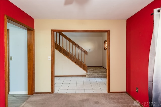 hallway with light colored carpet