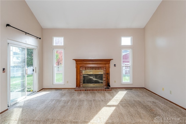 unfurnished living room featuring a fireplace, light colored carpet, and high vaulted ceiling