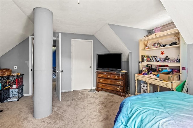 carpeted bedroom with vaulted ceiling