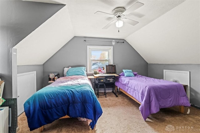 carpeted bedroom featuring ceiling fan and vaulted ceiling