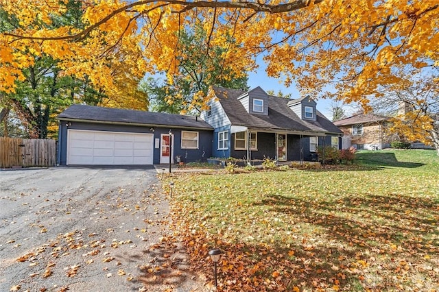 view of front of home featuring a front yard and a garage