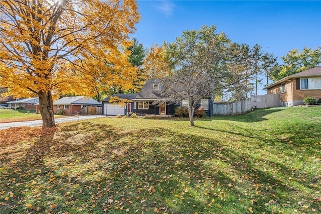 exterior space with a garage and a front lawn