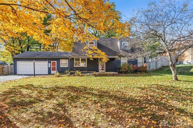 view of front of house with a garage and a front yard