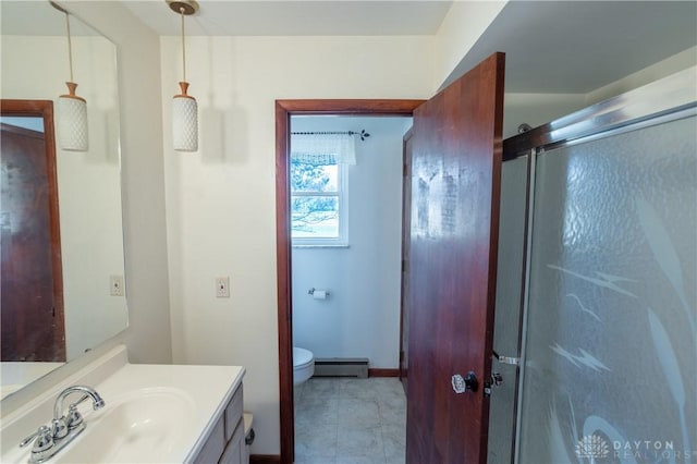 bathroom featuring vanity, a baseboard radiator, an enclosed shower, and toilet