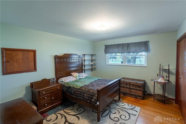 bedroom with light hardwood / wood-style flooring