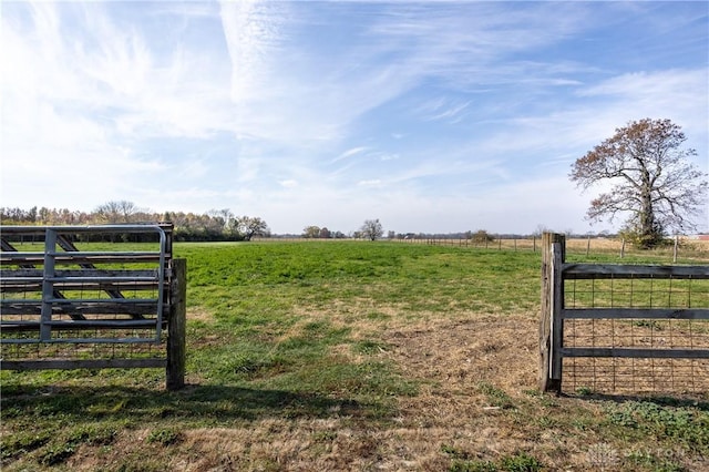 view of gate featuring a rural view