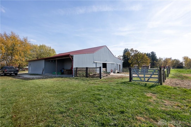 view of outbuilding featuring a lawn