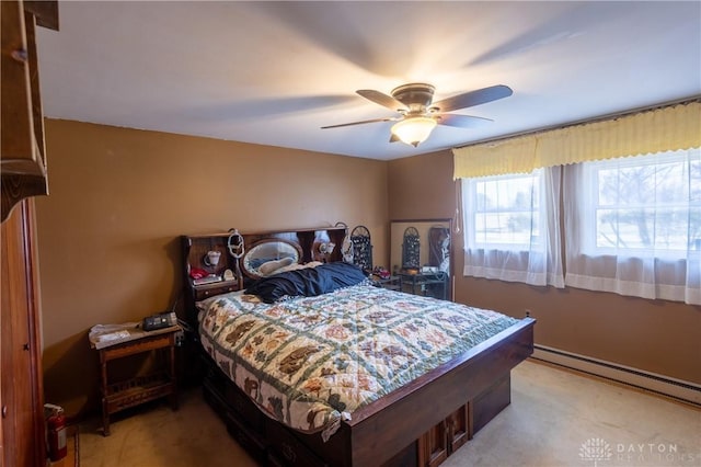 bedroom featuring ceiling fan, light colored carpet, and a baseboard radiator