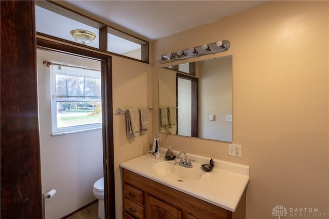 bathroom with vanity and toilet