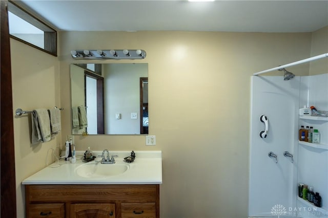 bathroom featuring vanity and a shower