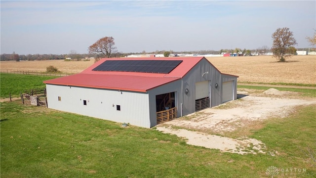 view of outbuilding featuring a rural view