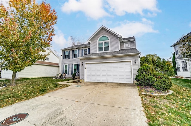 view of front property with a front yard and a garage