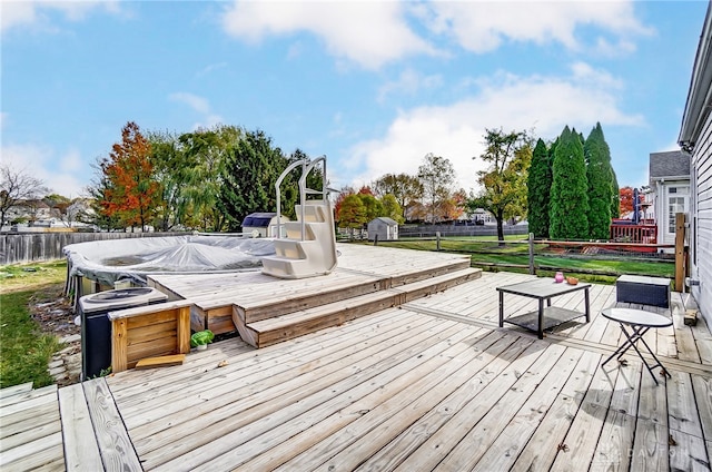 wooden terrace with a hot tub