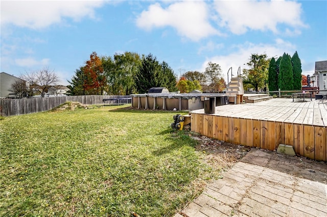 view of yard with a covered pool