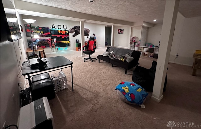 game room featuring carpet and a textured ceiling