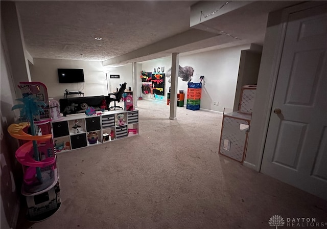 basement with carpet flooring and a textured ceiling