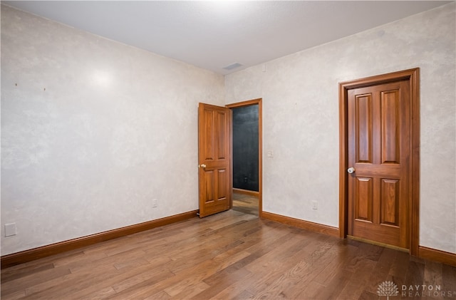 unfurnished bedroom featuring wood-type flooring