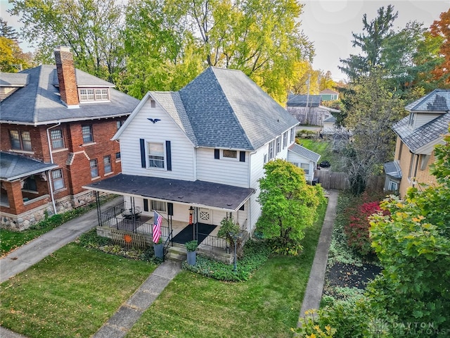 exterior space featuring a yard and covered porch