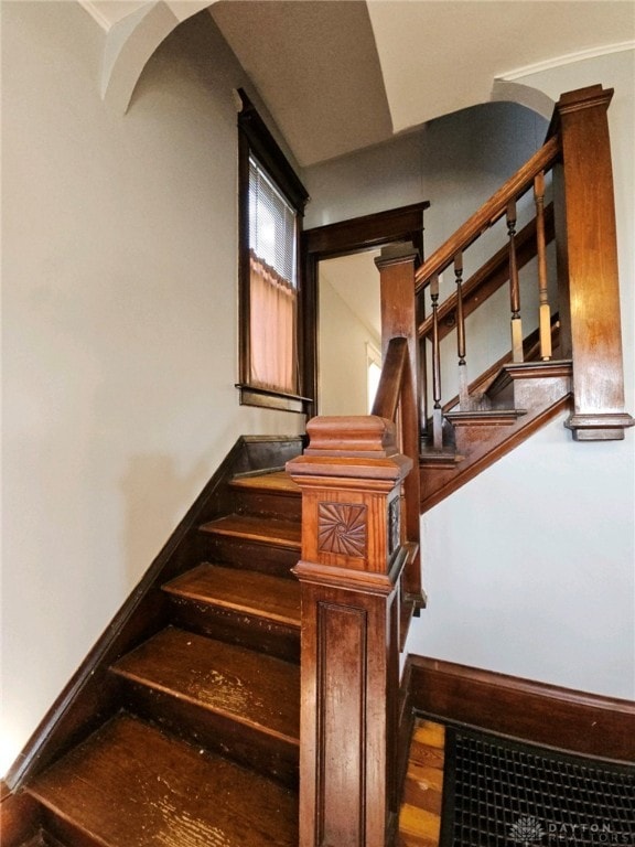 stairs featuring wood-type flooring