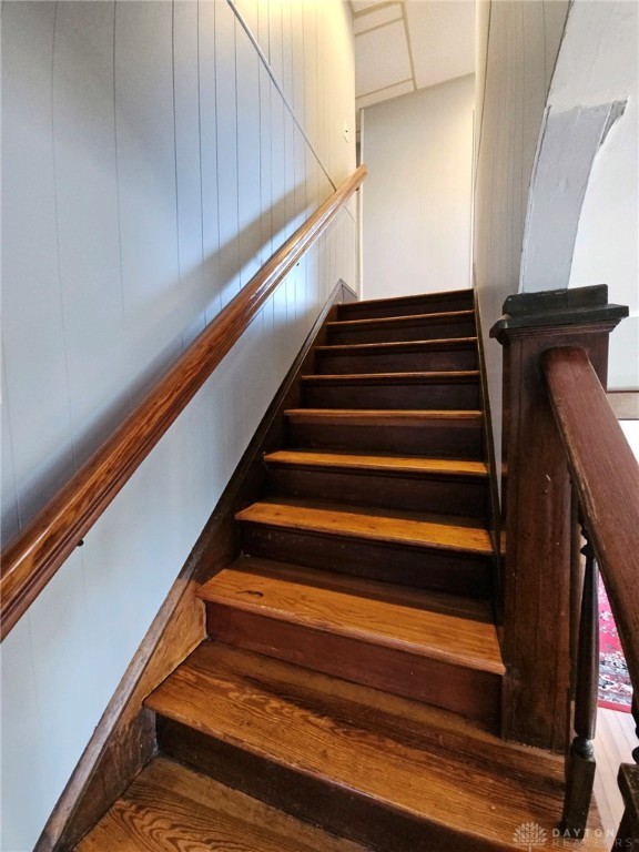 stairway featuring hardwood / wood-style floors