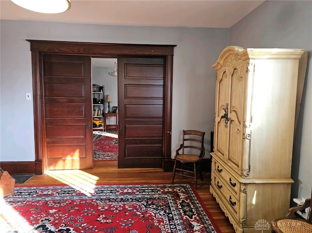 foyer with dark hardwood / wood-style floors