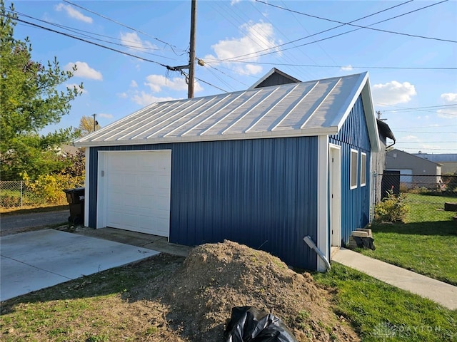 garage featuring a yard