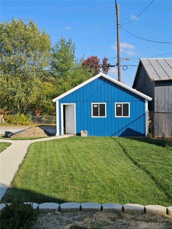 view of outbuilding featuring a yard