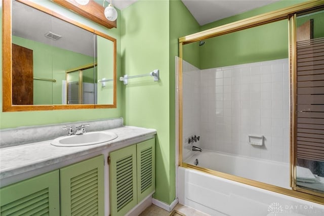 full bath featuring visible vents, vanity, and bathing tub / shower combination