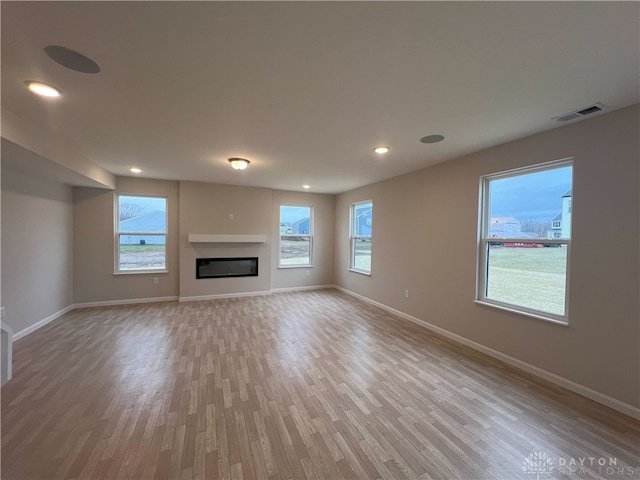 unfurnished living room with light hardwood / wood-style floors