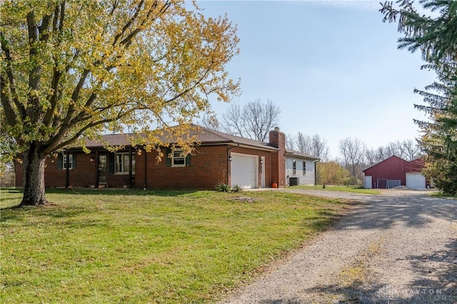 ranch-style house featuring central air condition unit and a front yard