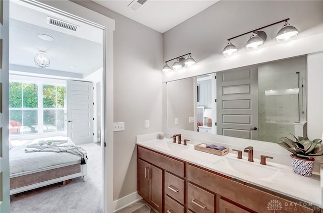 bathroom with a shower and vanity