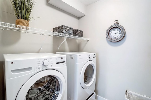 clothes washing area featuring washing machine and dryer