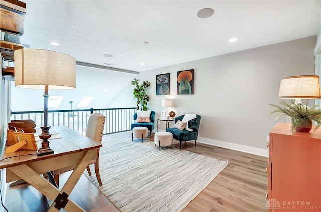 sitting room with hardwood / wood-style flooring