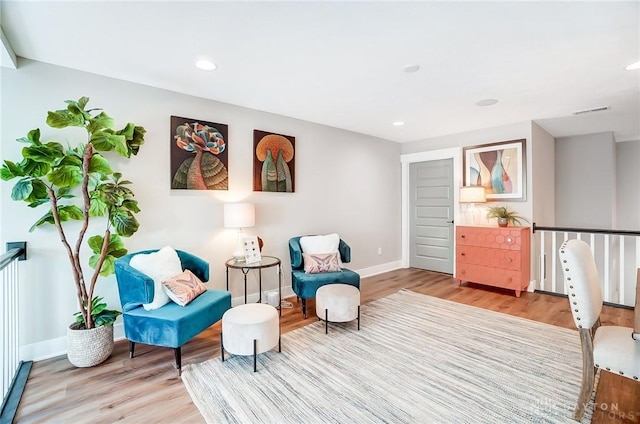 sitting room with light hardwood / wood-style floors