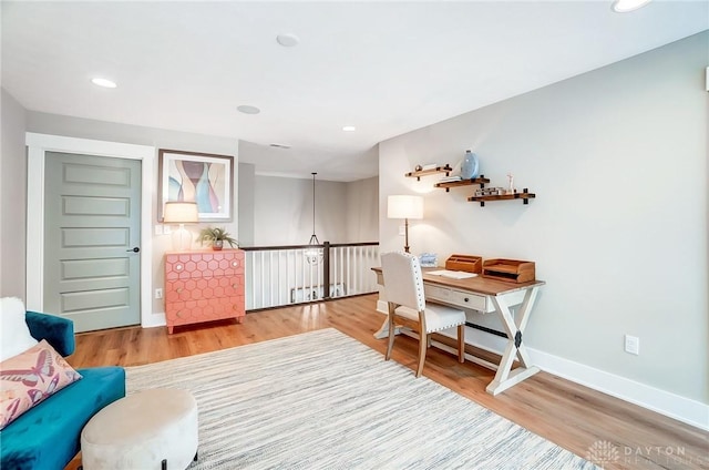 home office with hardwood / wood-style floors