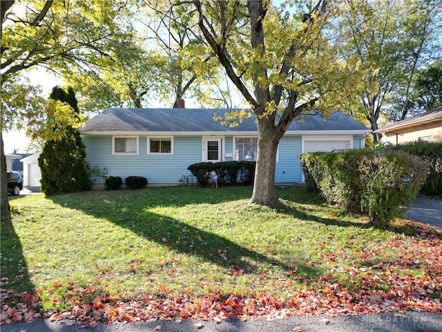 ranch-style home with a front lawn