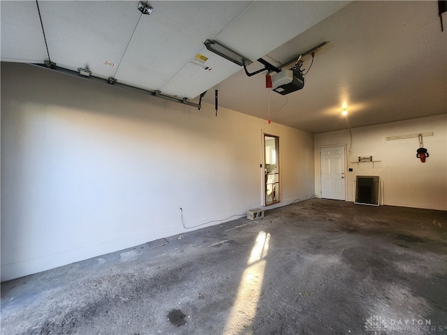 garage featuring a garage door opener