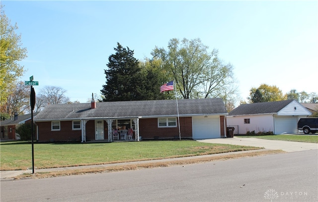 ranch-style house featuring a front yard and a garage