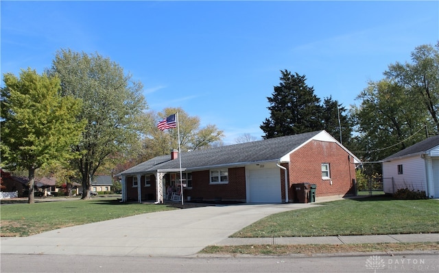 single story home featuring a front lawn and a garage