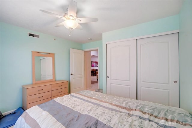 bedroom featuring a closet and ceiling fan