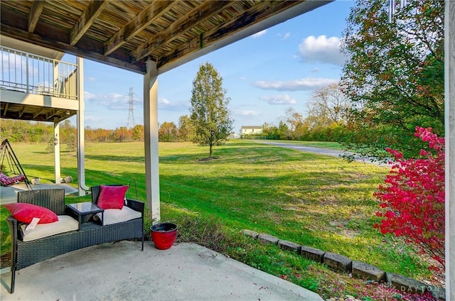 view of yard with a balcony and a patio